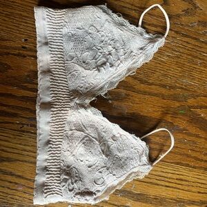 Out from under light pink bralette top